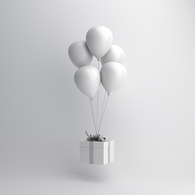 Decoración de invierno con globo blanco y caja regalo.