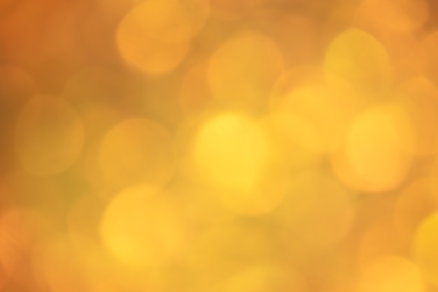 Defokussieren Sie helle goldene Weihnachtsfarbe. Glitzerhintergrund, neues Jahr.