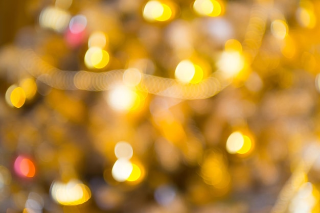 Defokussierte Weihnachtsbeleuchtung verschwommen funkelnde Flecken Bokeh-Effekt abstrakten Hintergrund, Weihnachten.