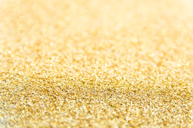 Defokussierter Goldglitterhintergrund