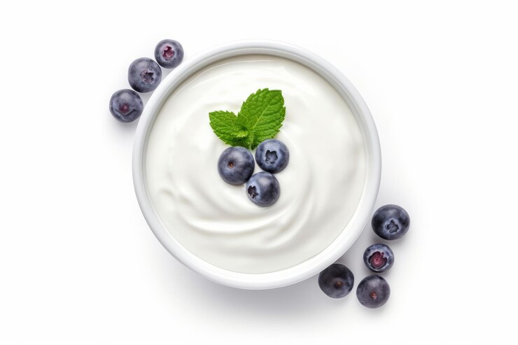 Foto delicioso iogurte orgânico servido numa tigela uma apresentação tentadora topview