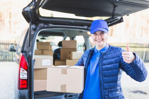 Delivery woman with carton box