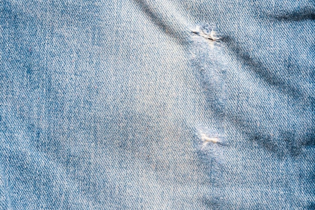 Denim Blue Jeans zerrissen Modedesign Textur Nahaufnahme Hintergrund Draufsicht