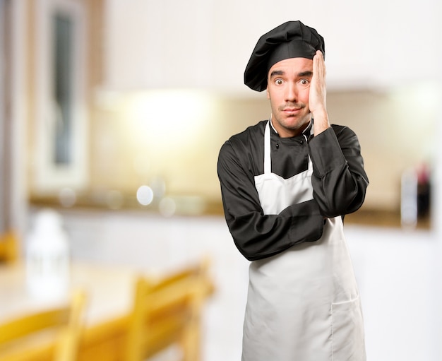 Depressed Young Chef posing