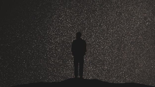 Der Mann steht auf einem sternenklaren Himmelshintergrund