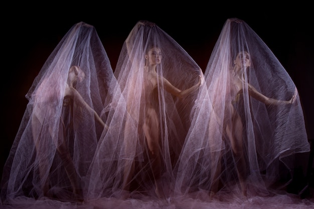 Der sinnliche und emotionale Tanz der schönen Ballerina mit Schleier. Fototechnik mit Stroboskop