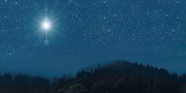 Foto der stern scheint über die weihnachtskrippe jesu christi