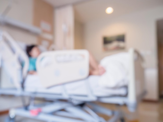 Desenfoque abstracto Paciente en la cama en el interior de la habitación del hospital para el fondo