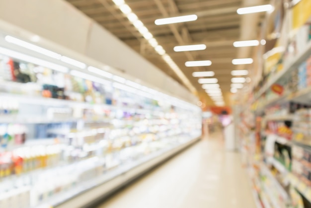 Desenfoque abstracto pasillo de la tienda de descuento del supermercado y estantes de productos interior fondo desenfocado