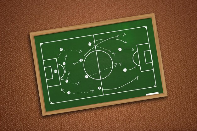 Foto desenho de futebol ou estratégia de jogo de futebol em quadro preto verde sobre parede texturizada