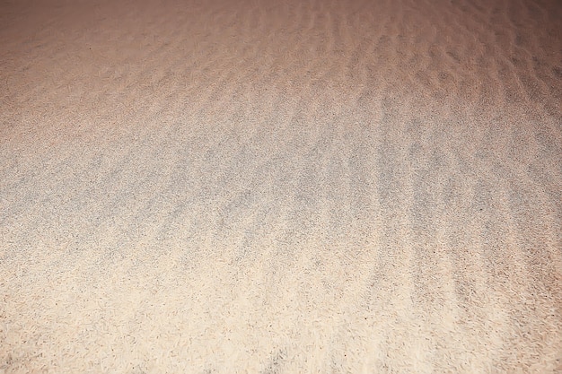 deserto de areia de fundo / fundo vazio abstrato, areia de deserto de textura, ondas, dunas de areia