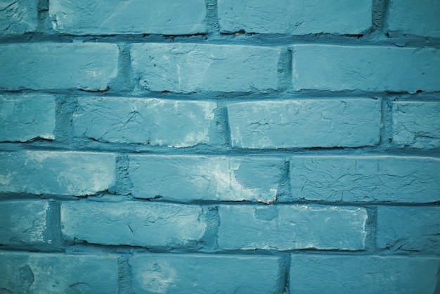 Detailshow der alten blauen backsteinmauer