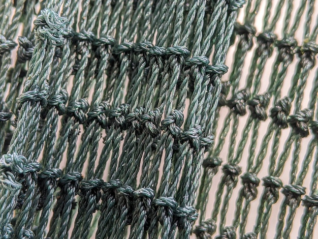 Detalhe da rede verde bordada
