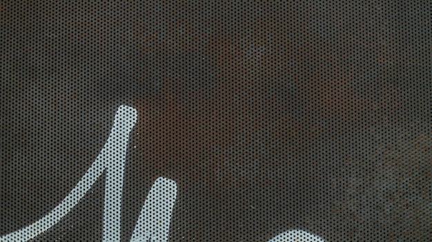 Detalhe da superfície de metal com padrão holey para backgrounds