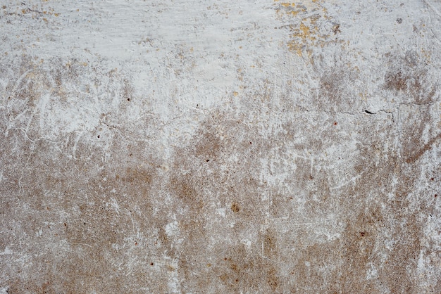 Detalhe de parede de concreto rachada suja. Copie o espaço