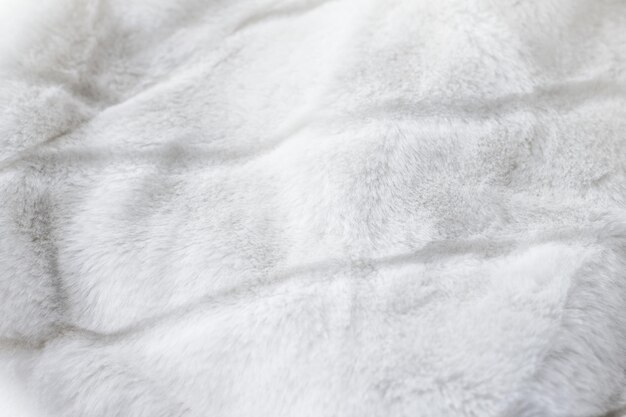 Detalhe de tecido artificial de fundo de textura de casaco de pele de luxo branco