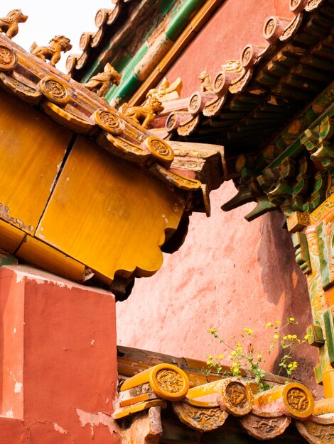 Detalhes de fachadas e telhados, Cidade Proibida em Pequim. Palácio Imperial na China.