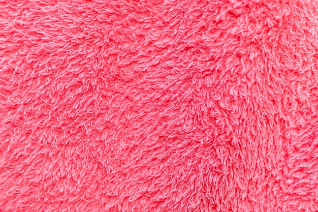 Foto detalle de la textura de una toalla rosa