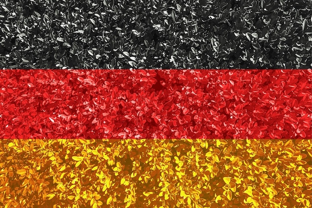 Foto deutsche flagge mit textur von blättern und sträuchern hintergrundbild für installation und design