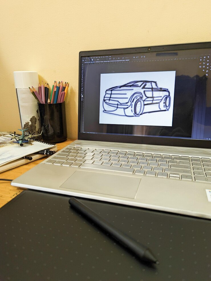 Foto un dibujo de un coche en una pantalla de portátil