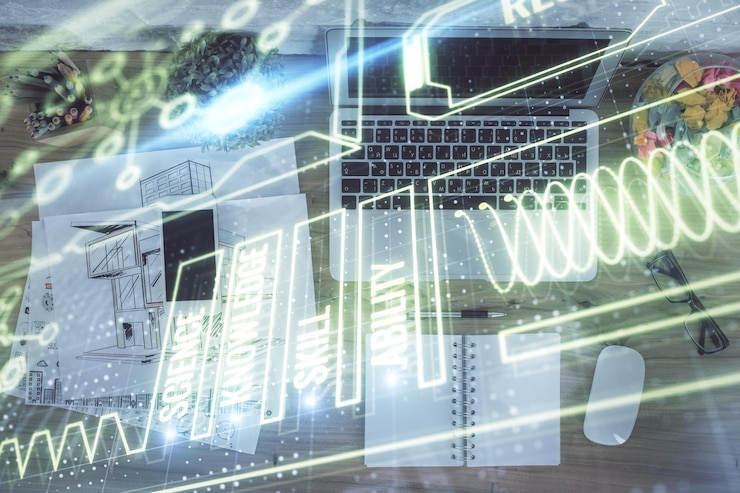 Foto dibujos de hologramas educativos sobre la computadora en el fondo del escritorio vista superior exposición múltiple