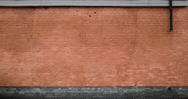 Die Beschaffenheit der Backsteinmauer vieler Reihen der Ziegelsteine gemalt in brauner Farbe