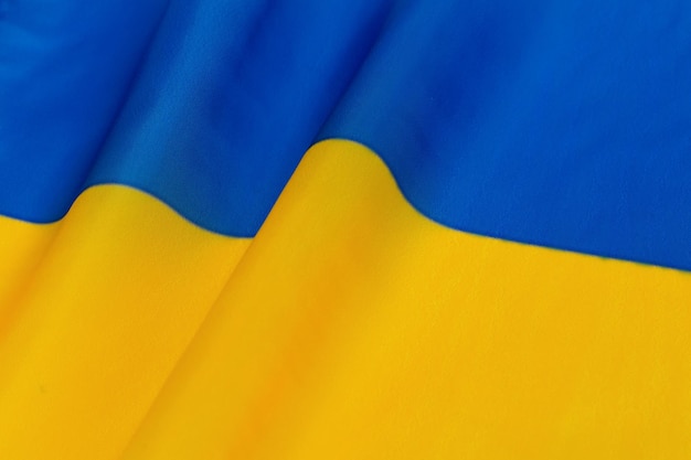 Die Flagge der Ukraine Hochdetaillierte gewellte Stoffstruktur