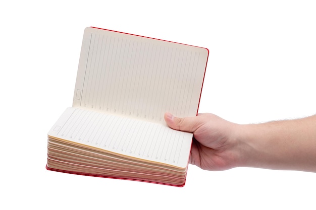 Die Hand eines Mannes und ein offenes Notizbuch für Notizen, die auf einem weißen Hintergrund isoliert sind