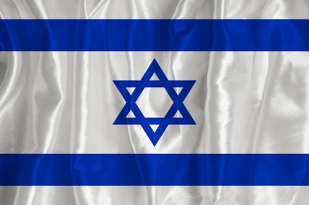 Die israelische Flagge auf Seidenhintergrund ist ein großartiges nationales Symbol Stoffstruktur Das offizielle Staatssymbol des Landes