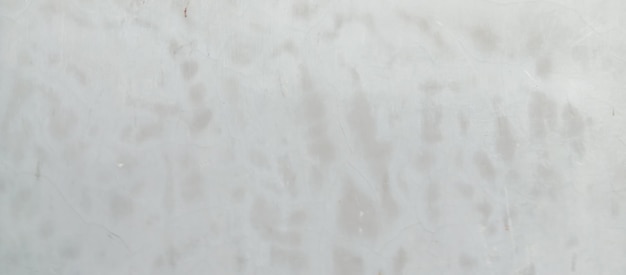 Foto die textur der alten zementwand mit silberner farbe bildet den hintergrund der alten wand aus silbernem zement