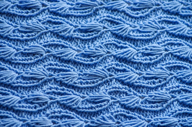 Die Textur eines gestrickten Wollstoffs blau.