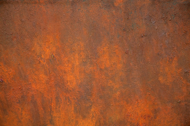 Foto die textur von rostigem metall ist braun und orange.