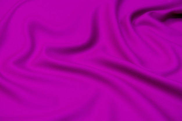 Die Textur von Seidenstoff in Fuchsia. Hintergrundmuster.