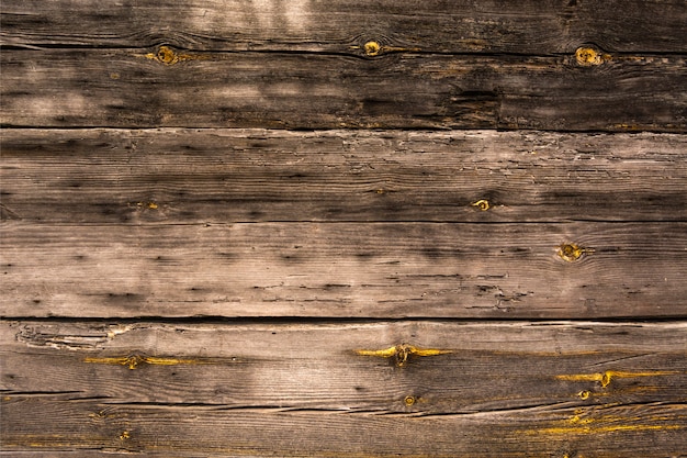 Foto die wand eines holzhauses. unlackierte alte bretter. die textur der bretter