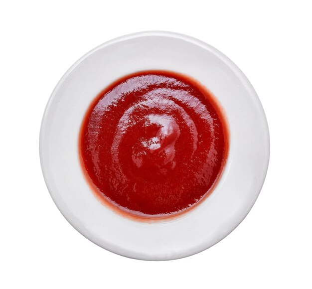 Foto diretamente acima da foto de ketchup em uma tigela sobre fundo branco