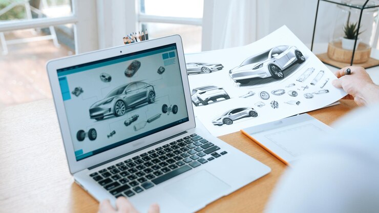 Foto diseñador de automóviles analizando cuidadosamente el prototipo de automóvil synchronos