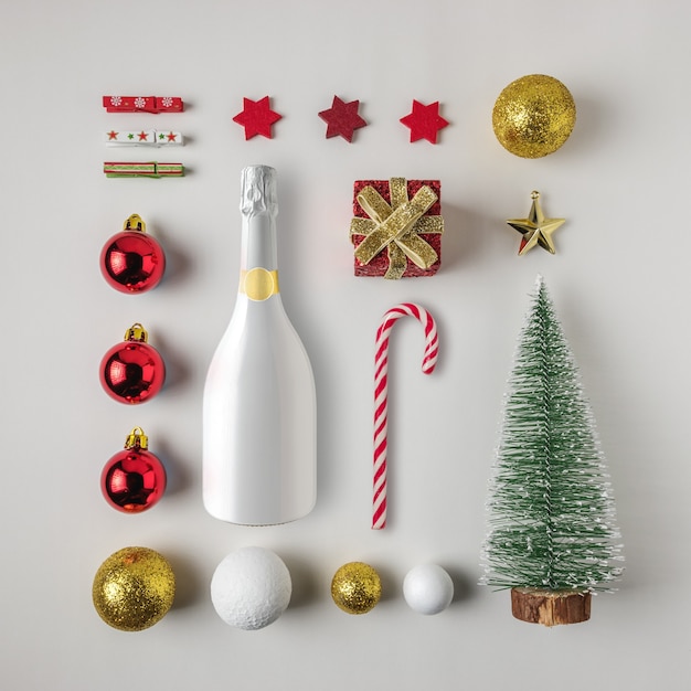 Diseño creativo hecho de decoración navideña de invierno y champán.