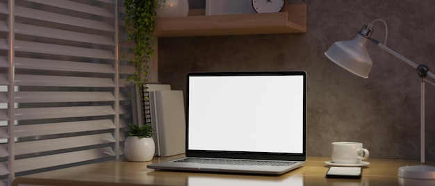 Diseño de espacio de trabajo de loft minimalista moderno con maqueta de computadora portátil en una mesa de madera sobre una pared de loft de cemento