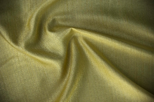 Diseño de fondo de seda ondulada brillante y diseño de textura curva abstracta de algodón amarillo utilizado en papel tapiz