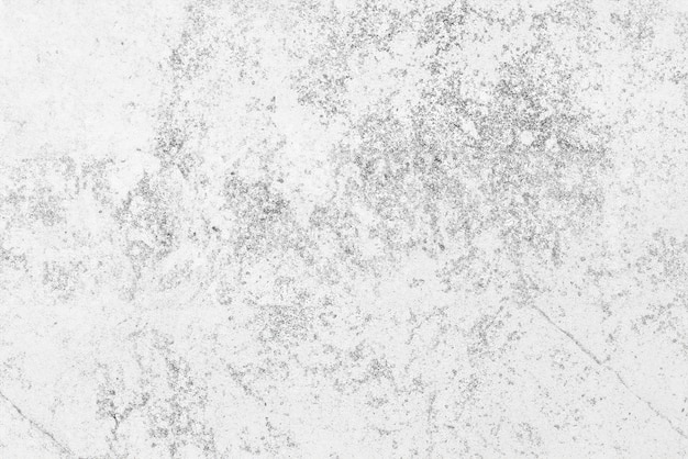 Diseño interior moderno textura de piedra caliza gris con acentos blancos iluminados en mesa de piedra de hormigón