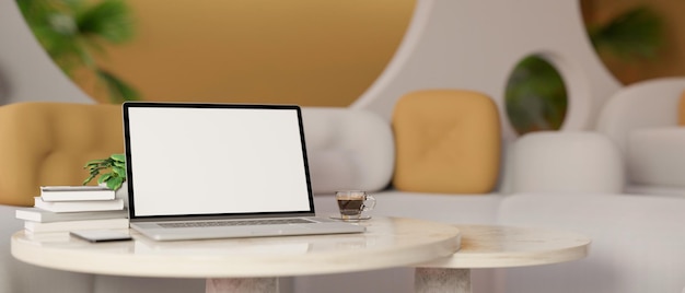 Diseño de interiores moderno y elegante en el lugar de trabajo con computadora portátil en una mesa redonda blanca