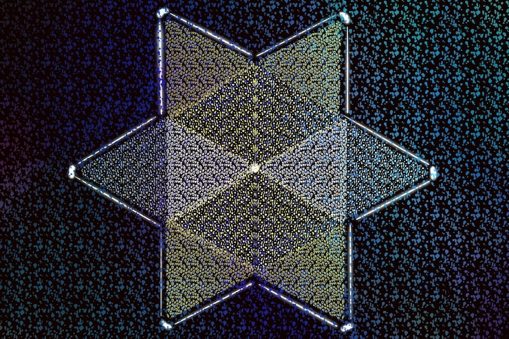 Foto diseño de triángulo simétrico sobre fondo de patrón de puntos de arco iris oscuro