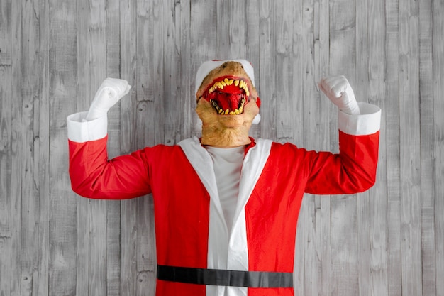 Disfraz de dinosaurio alegre como Santa Claus