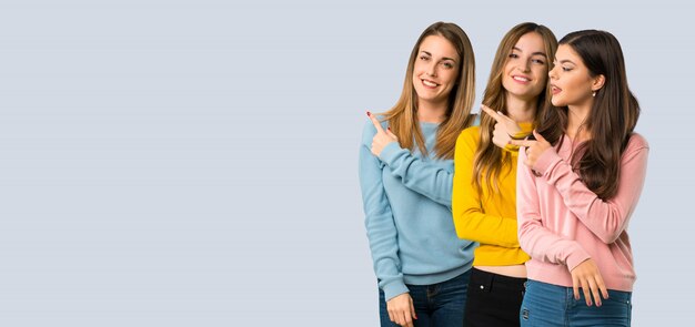 Foto un disparo de cuerpo entero de un grupo de personas con ropa colorida.