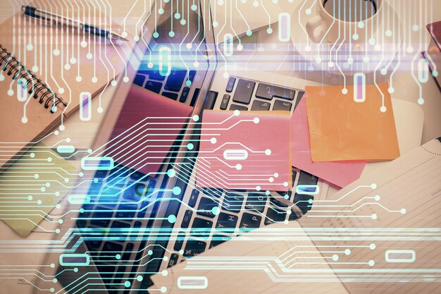 Doble exposición del boceto del holograma de datos sobre el fondo de la mesa de estudio con el concepto de computadora de la vista superior de Ai