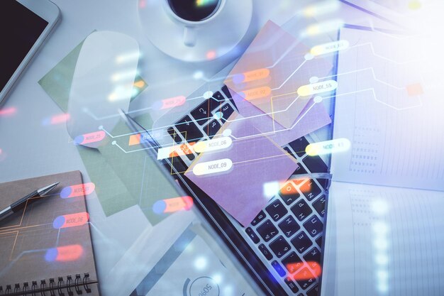 Doble exposición del boceto del holograma de datos sobre el fondo de la mesa de estudio con el concepto de computadora de la vista superior de Ai