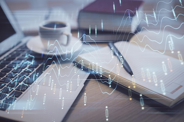 Doble exposición de dibujo de gráficos forex y escritorio con café y artículos en el fondo de la mesa Concepto de negociación en el mercado financiero