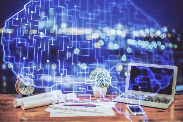 Doble exposición del escritorio con computadora y holograma de dibujo cerebral Concepto de inteligencia artificial
