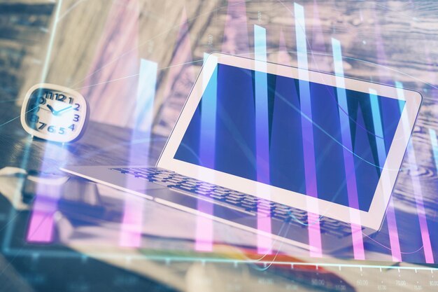 Doble exposición del gráfico de divisas y espacio de trabajo con computadora Concepto de comercio internacional en línea