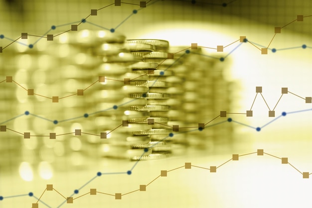 Doble exposición de gráfico y filas de monedas. Fondo de tendencias económicas para la idea de negocio y todo el diseño de obras de arte. Primer plano, poca profundidad de campo.